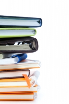 Image of notebooks piled on top of each other